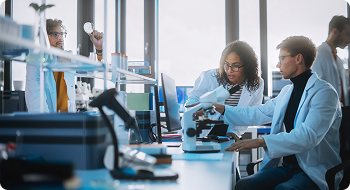 Team of scientists in a lab working on cancer news, research and innovations.