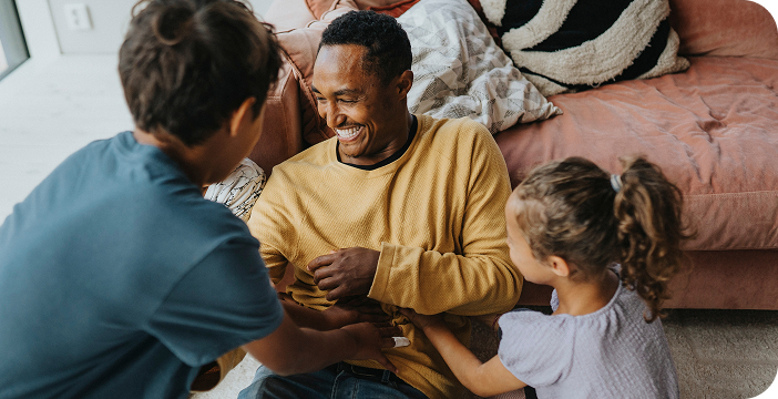 Happy family spending quality time together, benefiting from cancer resources.