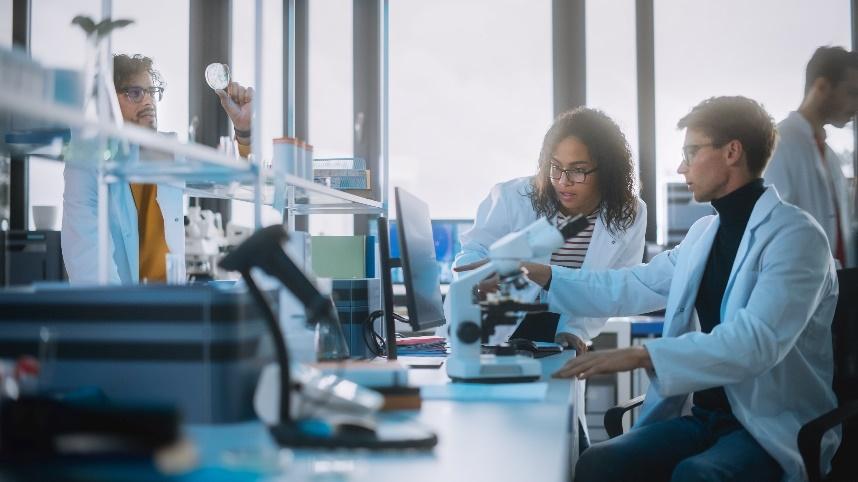 Team of scientists in a lab working on cancer news, research and innovations.